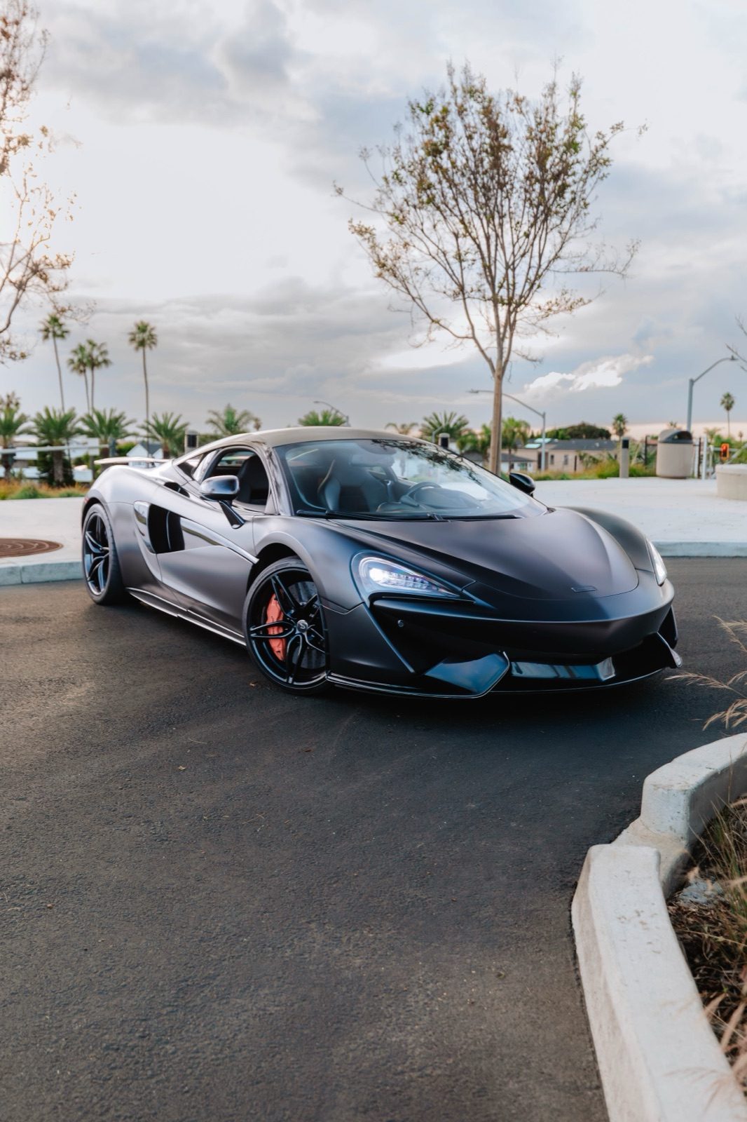 McLaren 570S satin black rental Orange County exotic car rental First Class Exotics